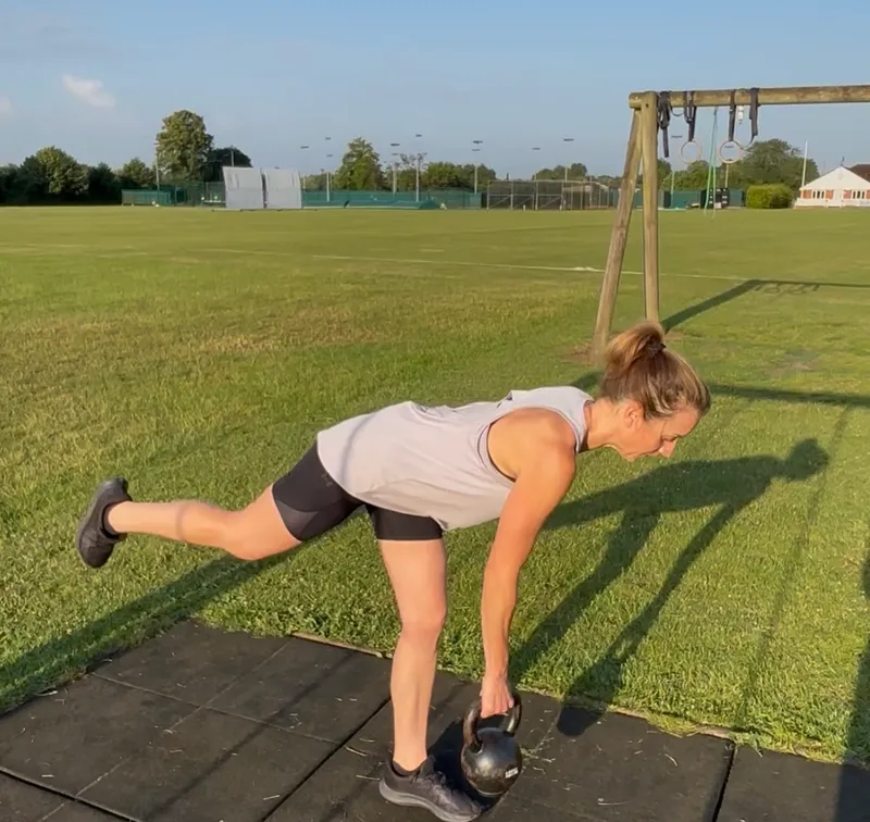 Client working on ring pull-up outdoors